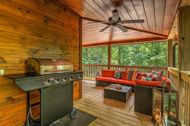 wooden terrace with an outdoor living space, area for grilling, and ceiling fan