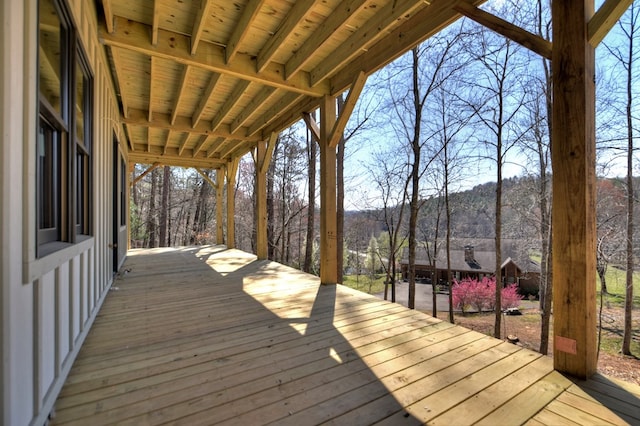 wooden deck featuring a mountain view