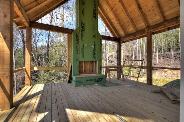 unfurnished sunroom with beam ceiling