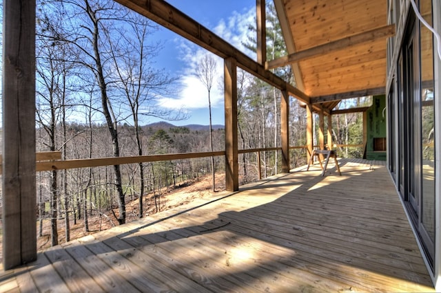 wooden deck featuring a mountain view