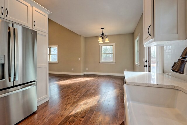 kitchen with white cabinetry, sink, tasteful backsplash, dark hardwood / wood-style floors, and appliances with stainless steel finishes