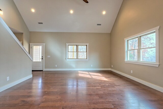 kitchen with dark hardwood / wood-style flooring, sink, white cabinets, and stainless steel appliances