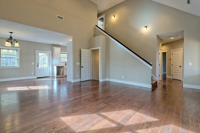 kitchen featuring white cabinetry, sink, appliances with stainless steel finishes, and dark wood-type flooring