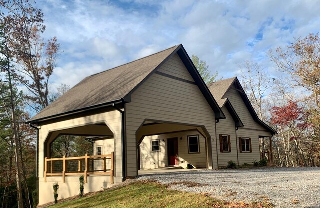 rear view of property featuring french doors and a deck