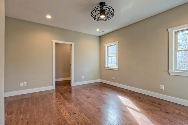 corridor featuring dark hardwood / wood-style flooring