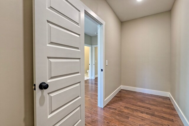 unfurnished room with ceiling fan and dark hardwood / wood-style floors