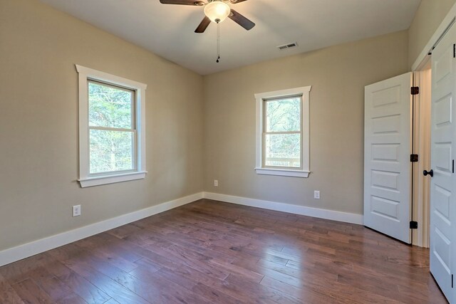 bathroom with an enclosed shower and hardwood / wood-style flooring