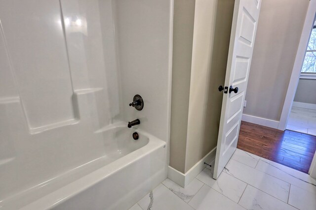 bathroom with vanity, hardwood / wood-style flooring, and lofted ceiling