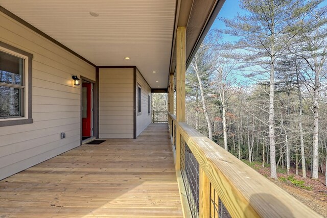 entryway with vaulted ceiling and dark wood-type flooring