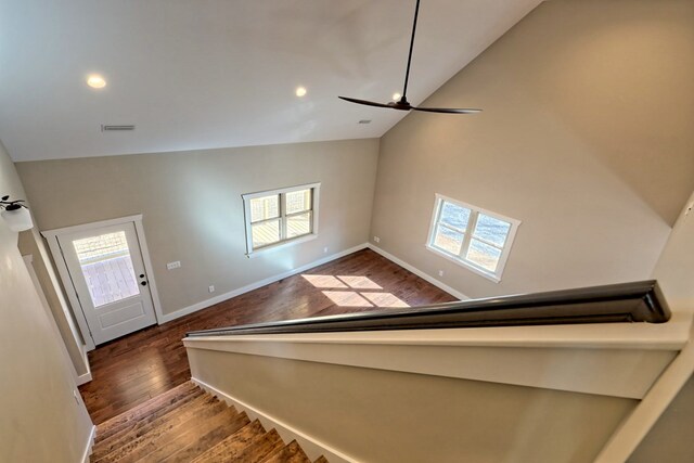 empty room with ceiling fan and hardwood / wood-style flooring