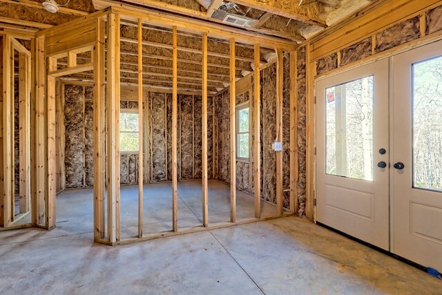 staircase featuring high vaulted ceiling, ceiling fan, wood-type flooring, and plenty of natural light