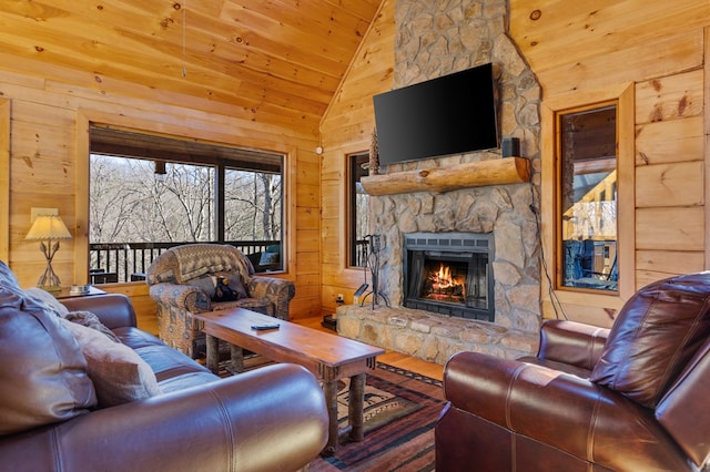 living room with a stone fireplace, wood-type flooring, wooden walls, wooden ceiling, and high vaulted ceiling