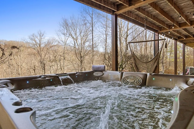 exterior space with a hot tub