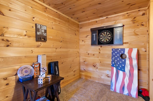 home office featuring wooden ceiling, wood walls, and carpet flooring