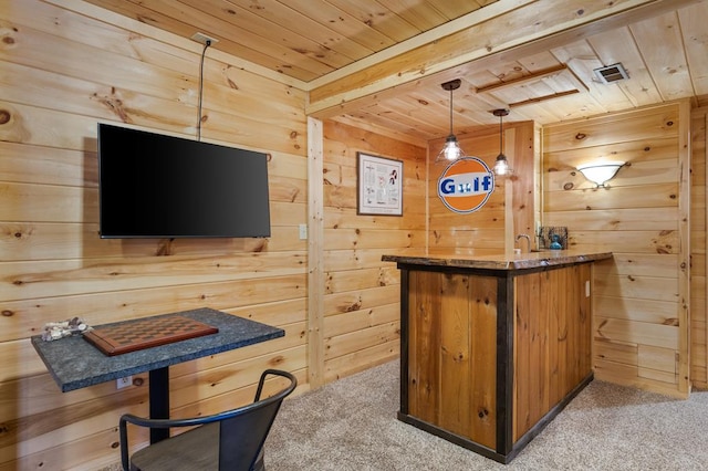 bar with wooden walls, wooden ceiling, light carpet, and decorative light fixtures