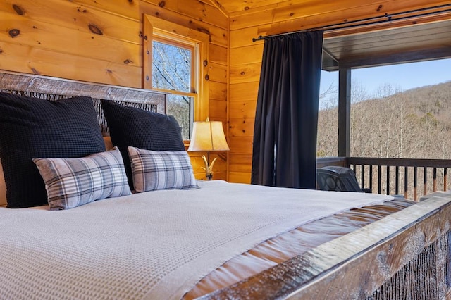 bedroom with wooden walls