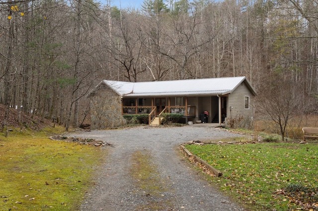 view of front of home featuring a front yard and a porch