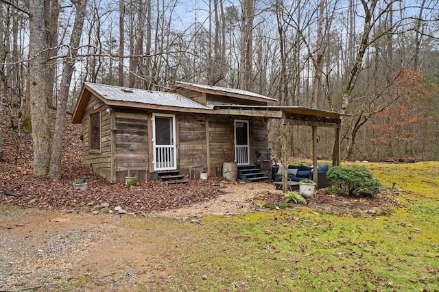 view of outdoor structure featuring a lawn