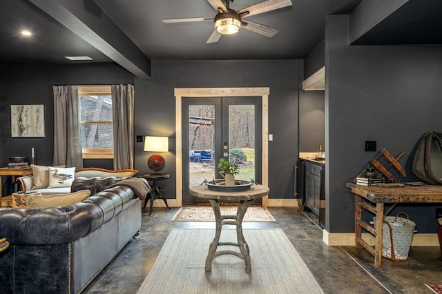 living room with ceiling fan and french doors