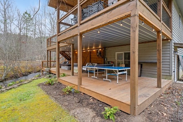 wooden deck featuring a trampoline