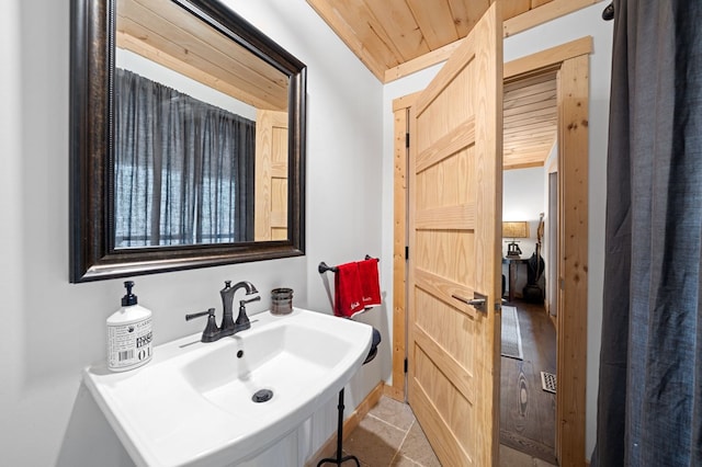 bathroom featuring sink and wooden ceiling