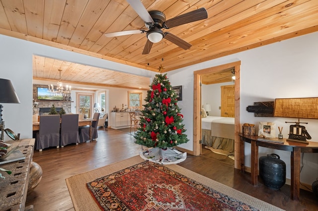 living room featuring wood ceiling, ceiling fan with notable chandelier, and dark wood-type flooring