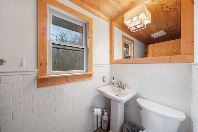 bathroom featuring wood ceiling and toilet