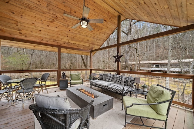 sunroom / solarium with wooden ceiling, vaulted ceiling, and ceiling fan