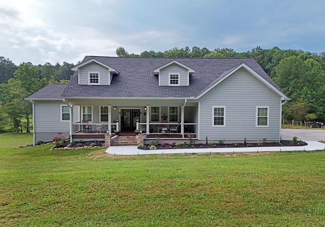 cape cod house with a porch and a front yard