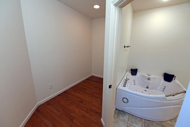 carpeted bedroom featuring ceiling fan, a spacious closet, and a closet