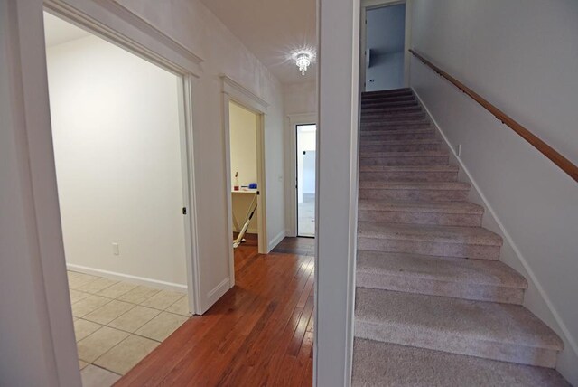 bedroom featuring light colored carpet and ceiling fan