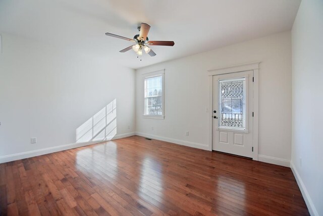 foyer with french doors, wood-type flooring, and a chandelier