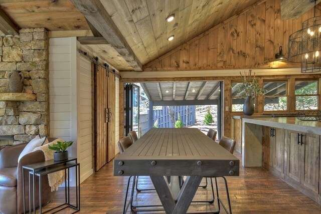 sunroom featuring a barn door