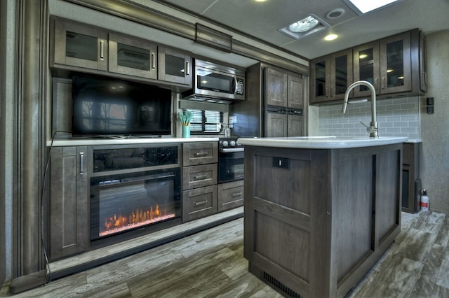 interior space featuring decorative backsplash and dark hardwood / wood-style floors