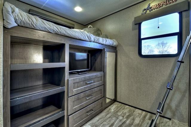 unfurnished bedroom featuring light wood-type flooring