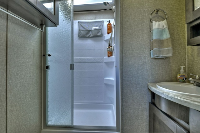 bathroom with vanity and walk in shower