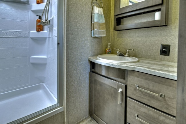 bathroom featuring vanity and walk in shower