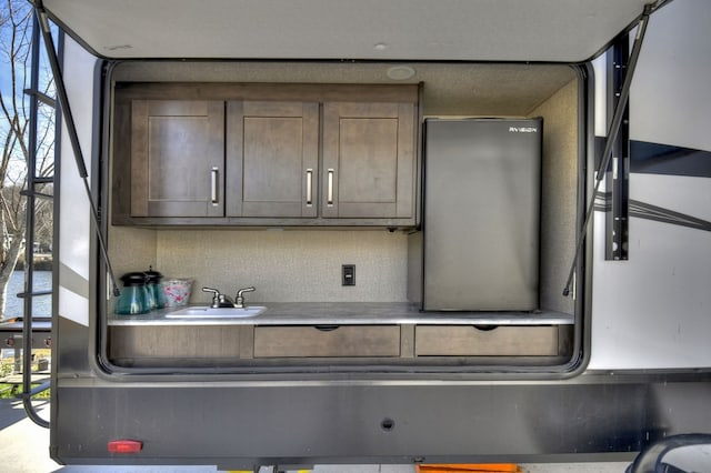 kitchen with decorative backsplash and sink