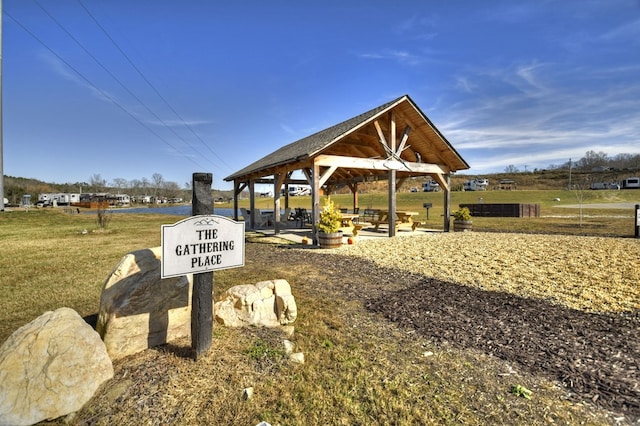 view of property's community with a gazebo and a yard