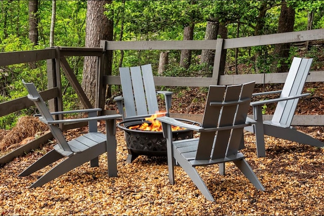 view of play area featuring an outdoor fire pit