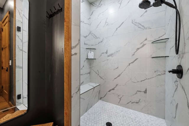 full bathroom featuring a marble finish shower