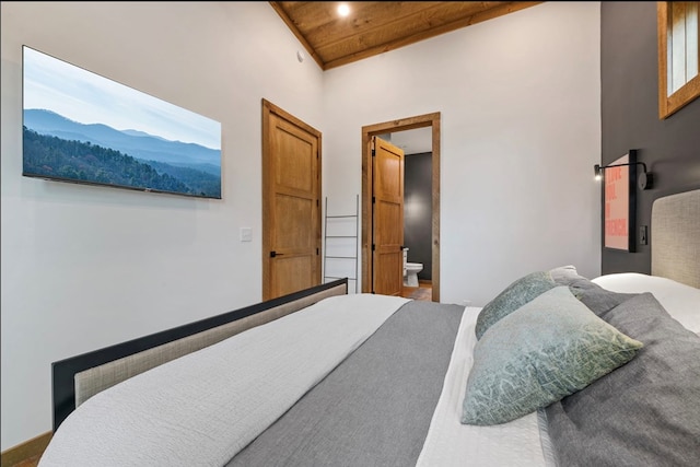 bedroom featuring wood ceiling and ensuite bathroom