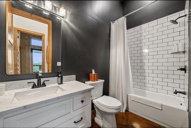 bathroom with toilet, shower / tub combo with curtain, and vanity