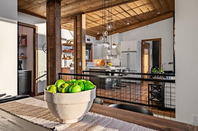 bar with pendant lighting, high end fridge, wood ceiling, and backsplash