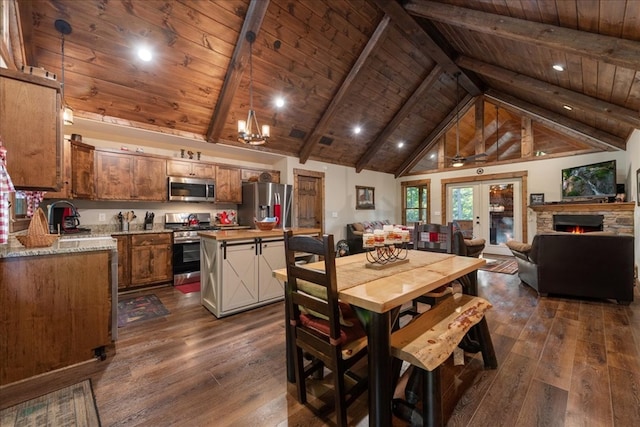 dining area with wood ceiling, beam ceiling, and dark hardwood / wood-style floors