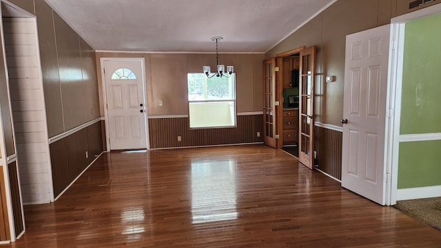349 Kirby Ln, Murphy, NC 28906 - foyer with a chandelier, ornamental molding, a wainscoted wall, and dark wood finished floors