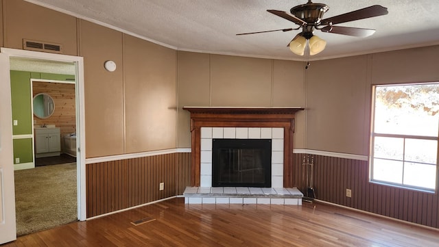 349 Kirby Ln, Murphy, NC 28906 - unfurnished living room with a textured ceiling, wood finished floors, ceiling fan, and crown molding