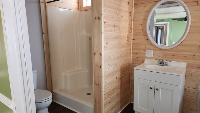 349 Kirby Ln, Murphy, NC 28906 - bathroom with toilet, wooden walls, vanity, and a stall shower