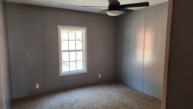 349 Kirby Ln, Murphy, NC 28906 - carpeted spare room with a textured ceiling, a decorative wall, and a ceiling fan