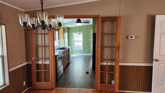 349 Kirby Ln, Murphy, NC 28906 - kitchen with freestanding refrigerator, crown molding, stainless steel range with electric stovetop, dark wood finished floors, and a sink